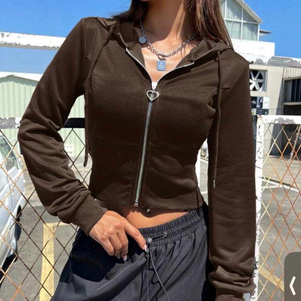 A zip up fitted sweater or hoodie